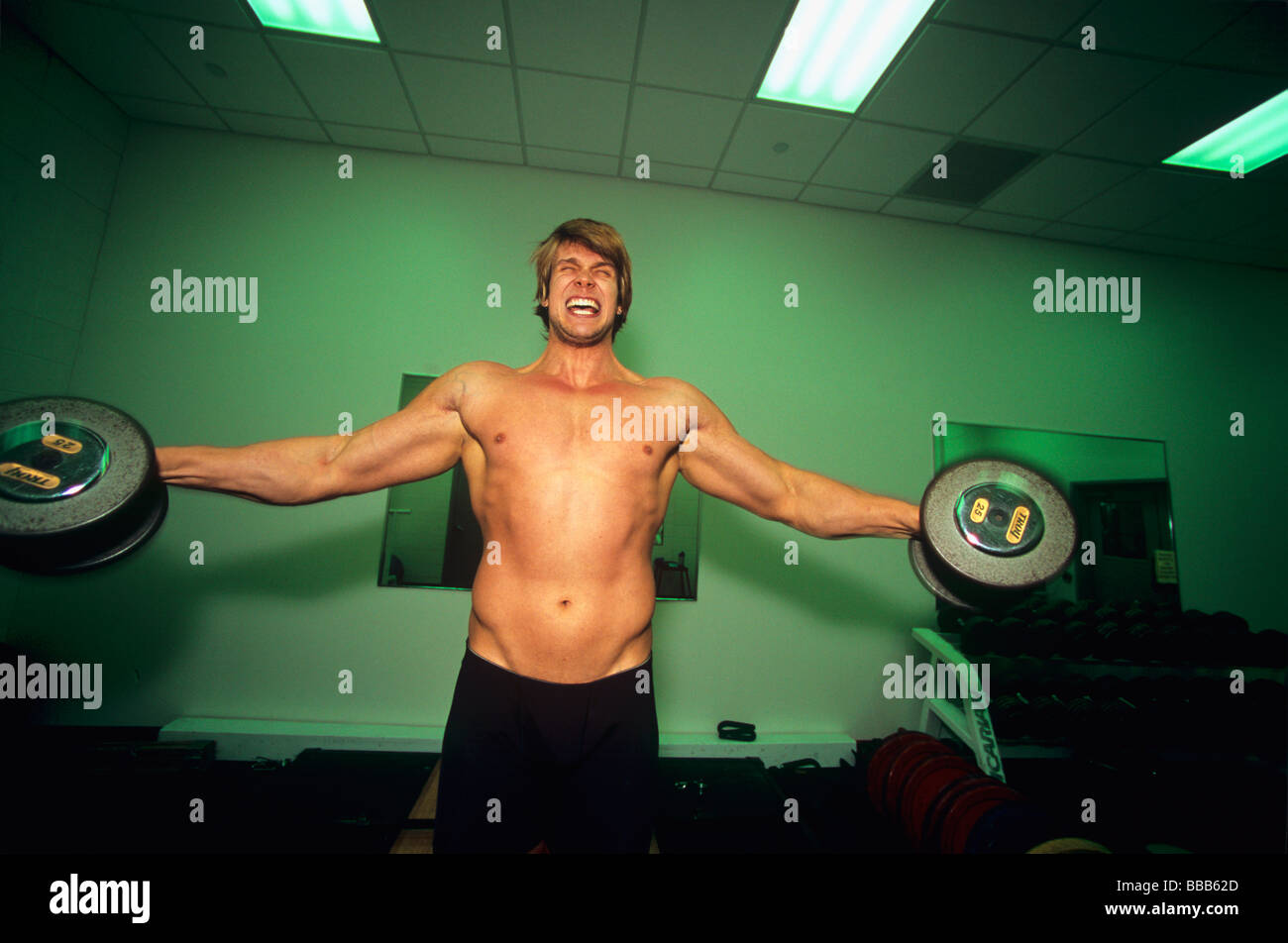 Body builder exercises vigorously Stock Photo Alamy
