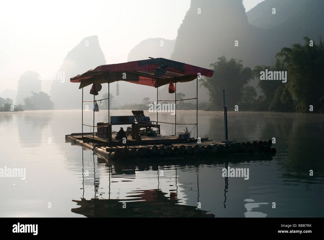 Traditional asian pavilion on lake in mountain area; Stock Photo