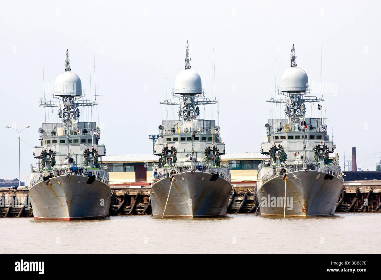 Three battleships docked in port Stock Photo