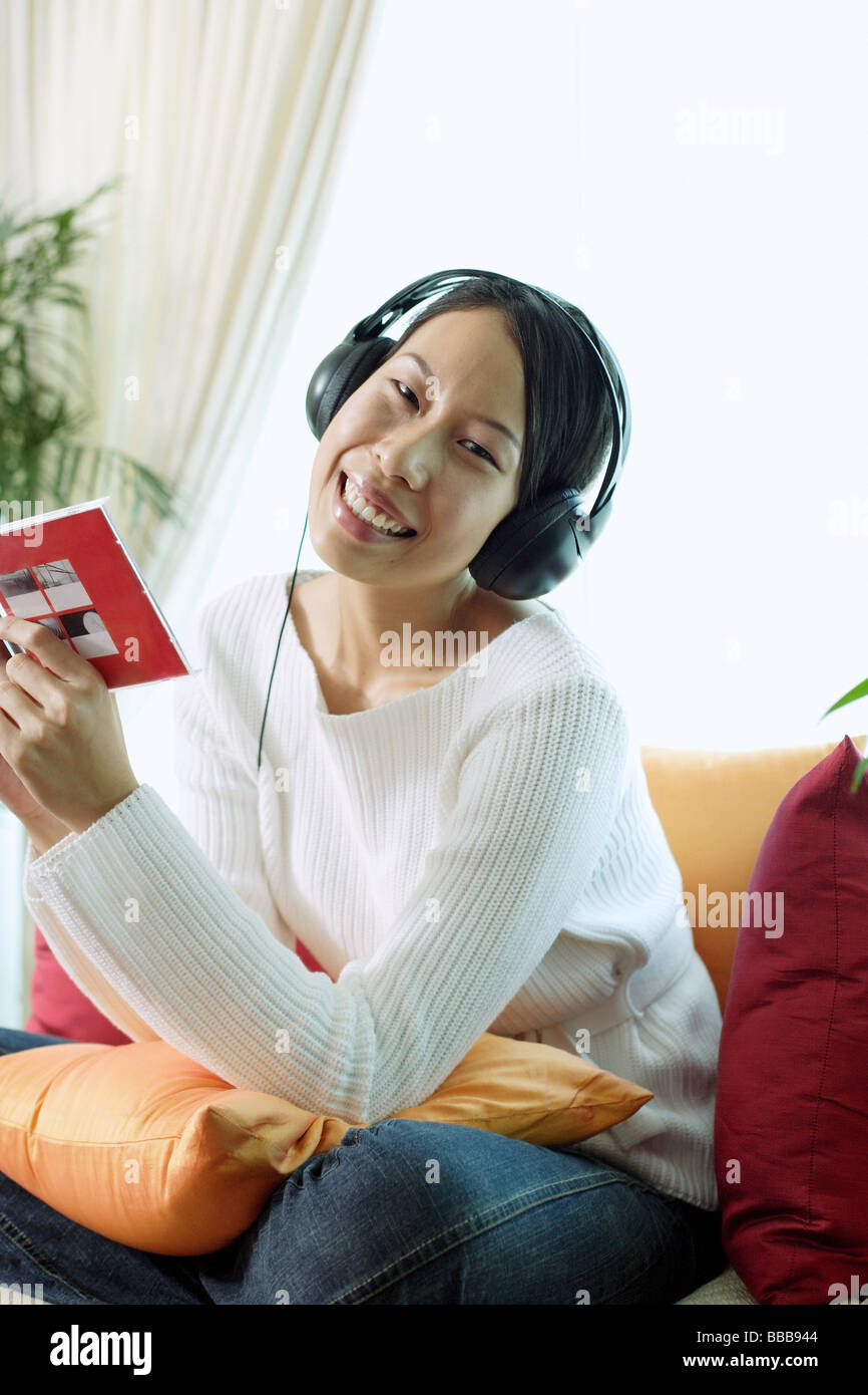 Happy asian woman headphones hi-res stock photography and images - Alamy