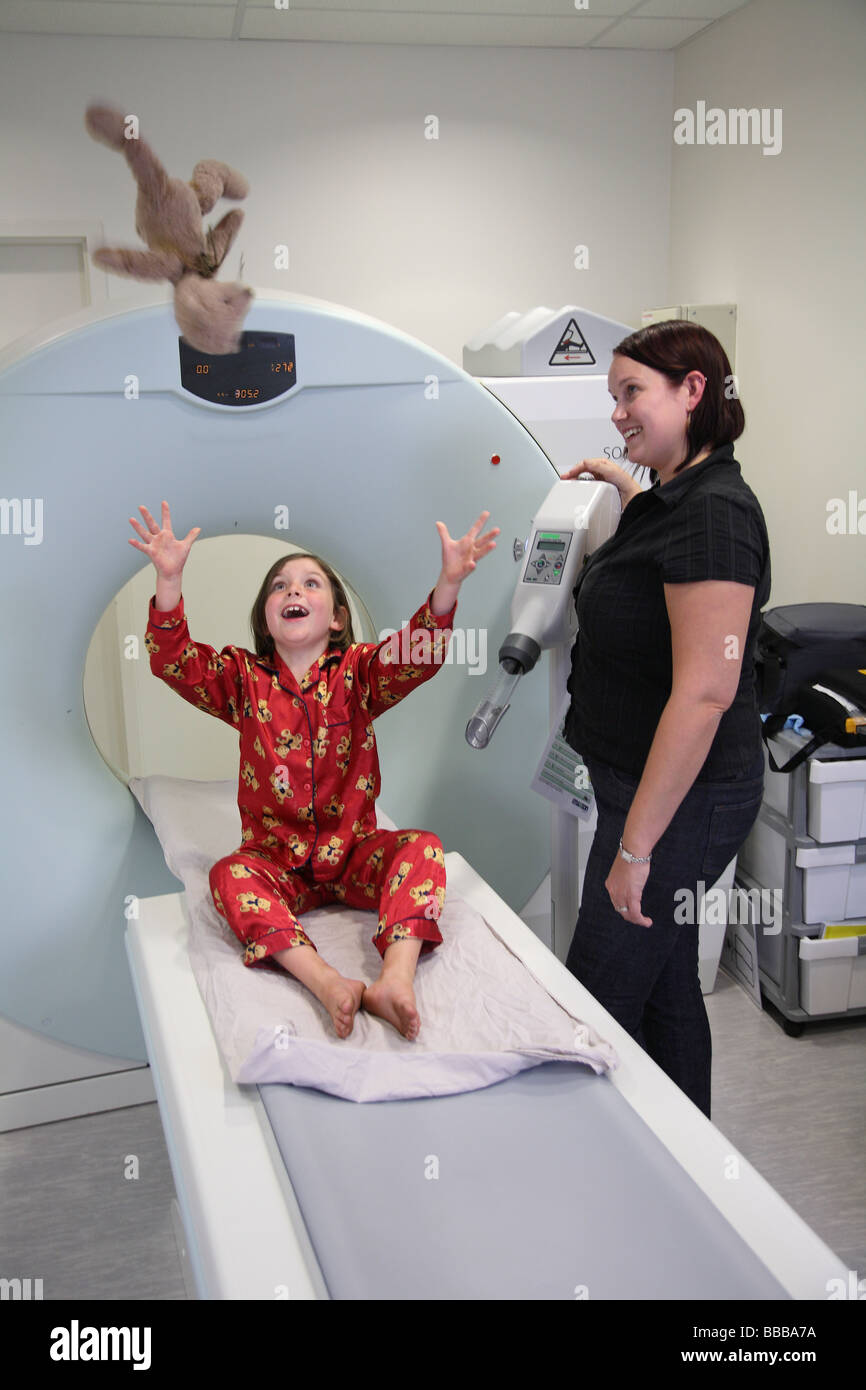 Child waiting to have imaging done on CT machine Stock Photo