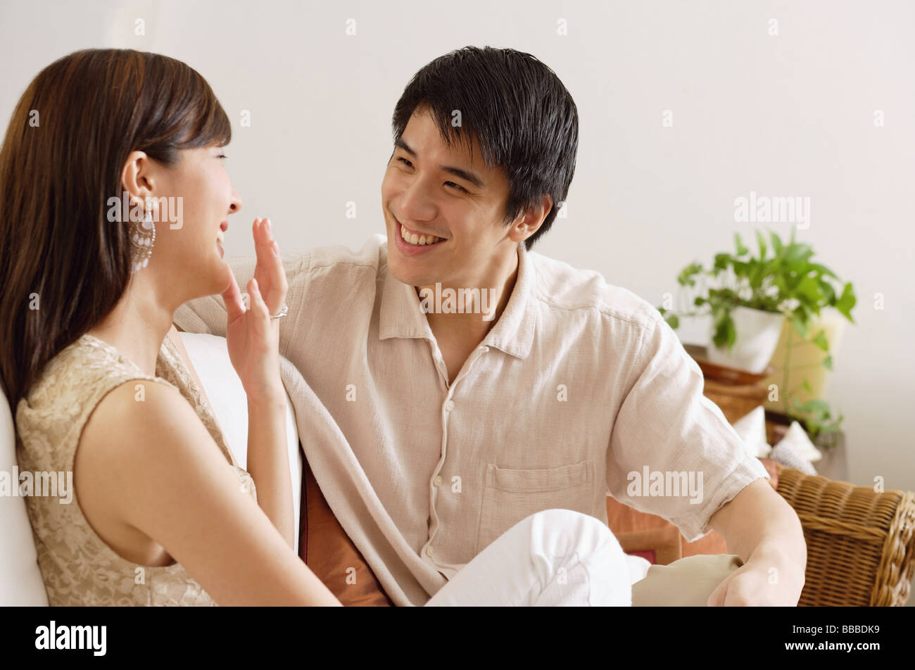 Sitting couple on sofa hi-res stock photography and images - Alamy