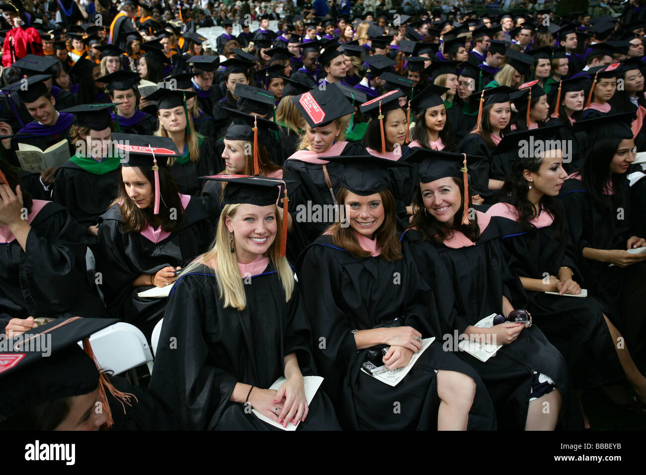 Yale University graduates smile as they receive their degrees at Yale Commencement Ceremonies Stock Photo