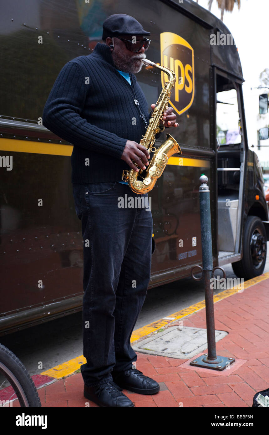 Street busker playing a saxophone, Santa Barbara, California, USA Stock Photo