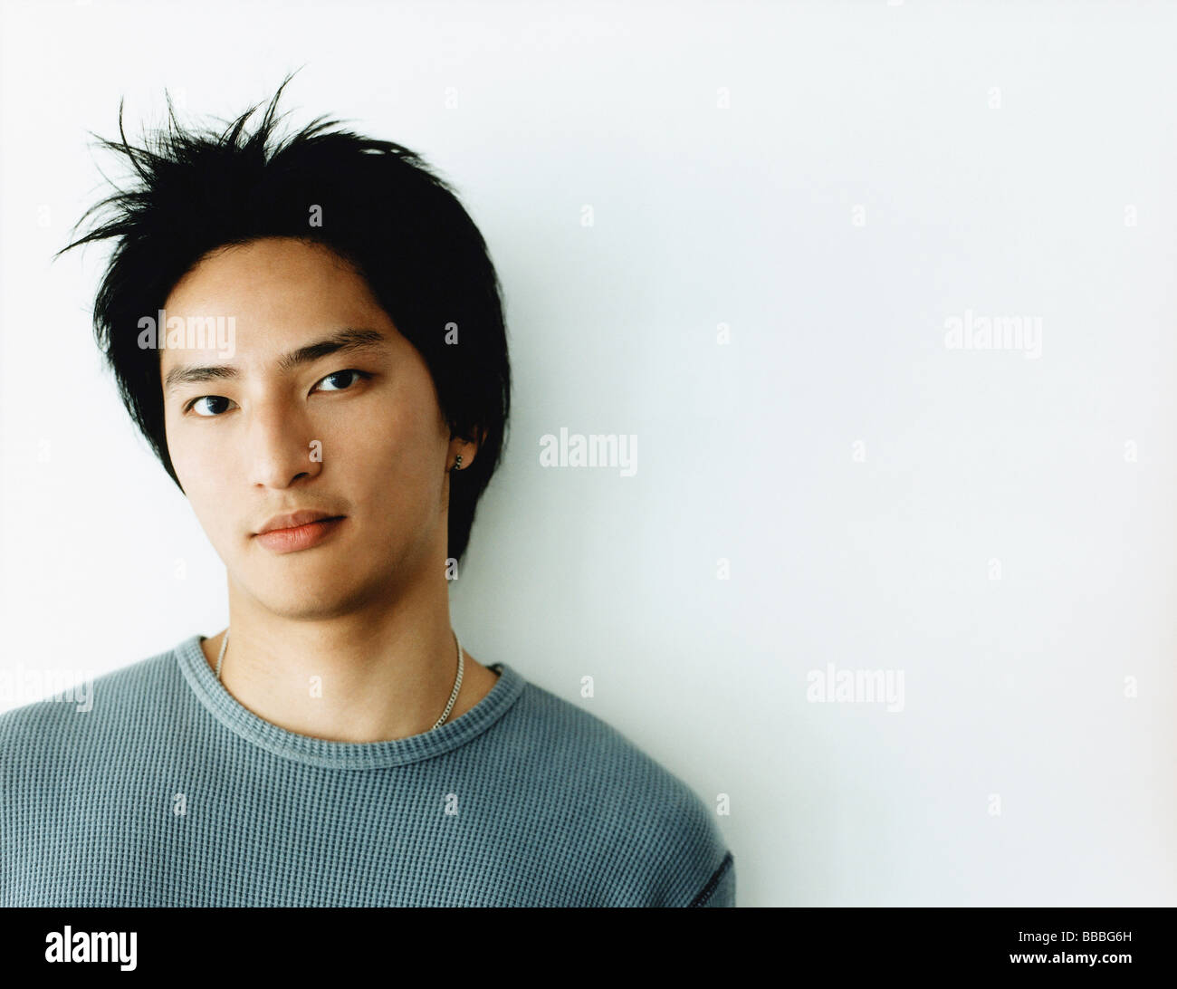 Young man against white background, portrait Stock Photo - Alamy
