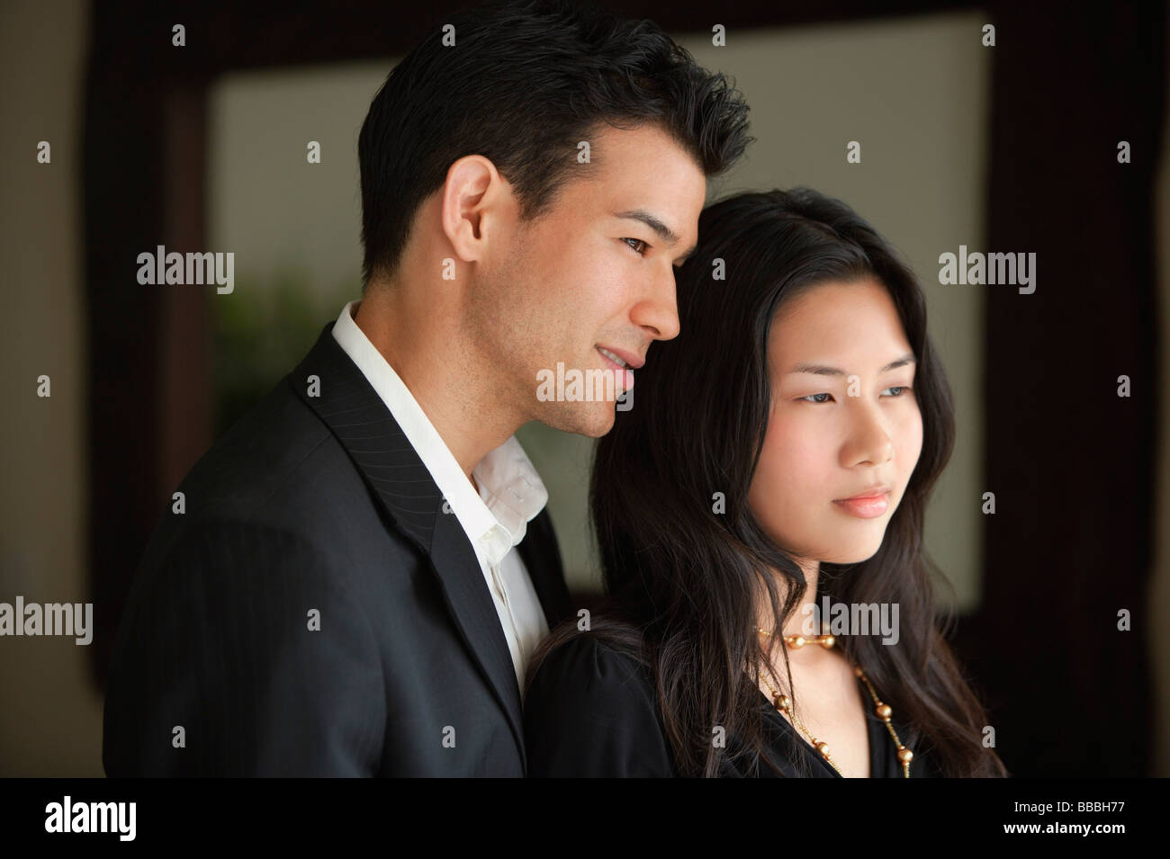 Young couple looking into distance Stock Photo