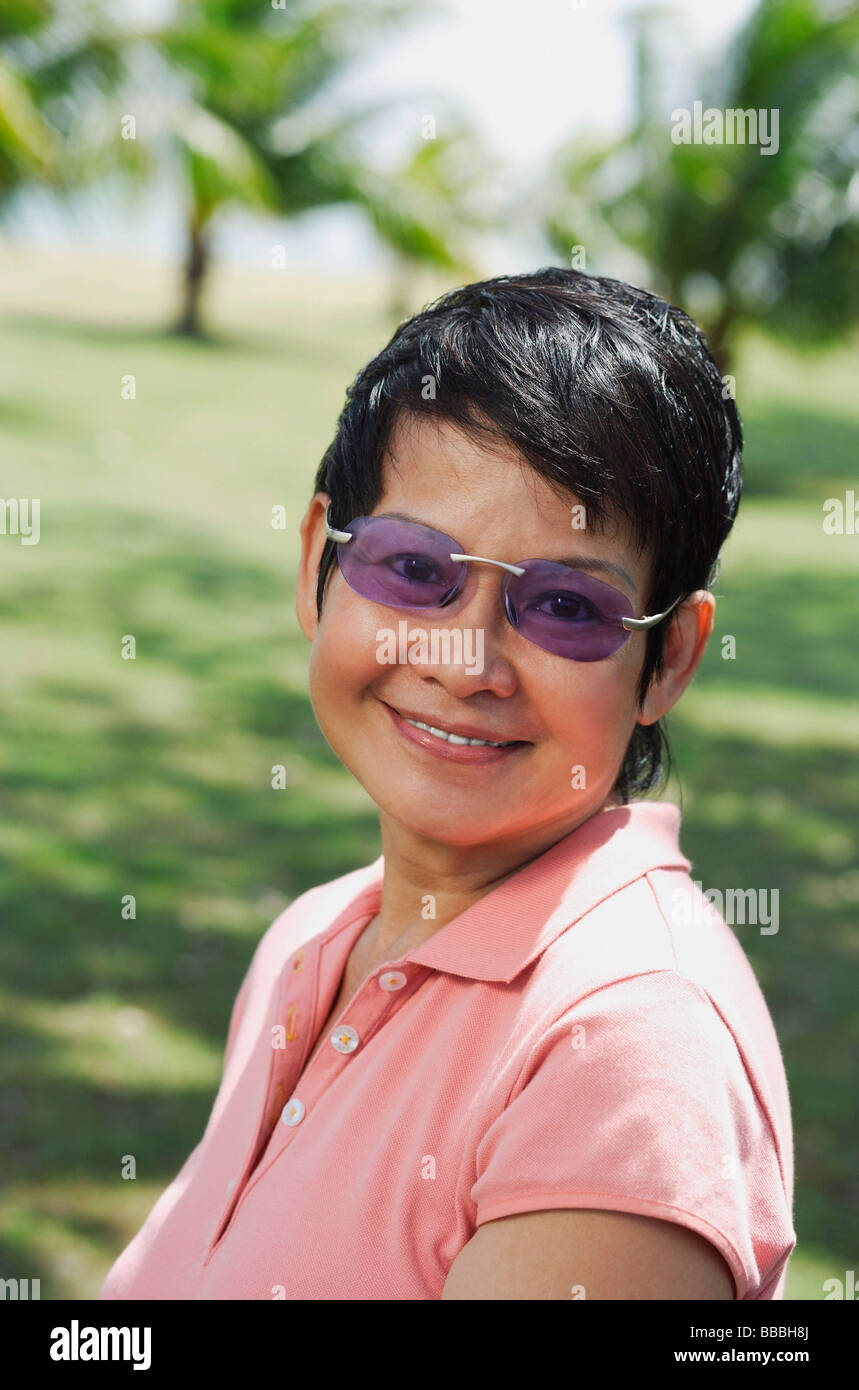 Woman in the park smiling at camera Stock Photo - Alamy