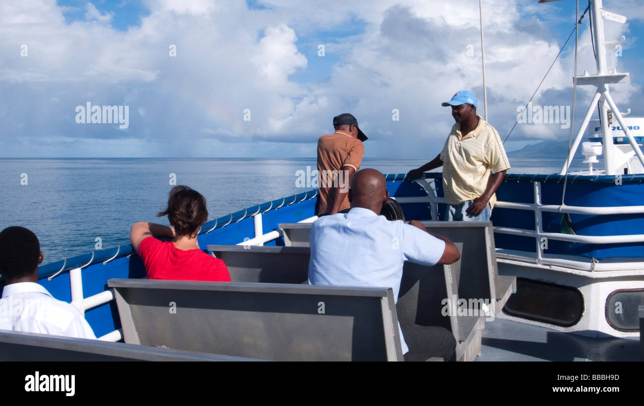 Passengers aboard inter island ferry Voyager Cat 27 en route to Basseterre St Kitts from Charlestown Nevis Stock Photo