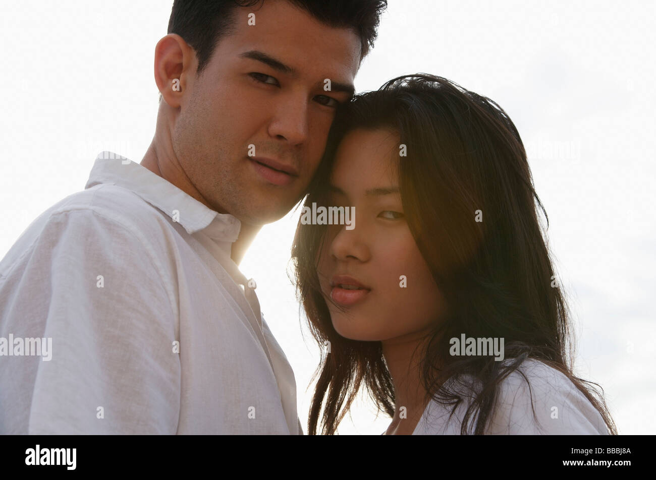 Young couple looking at camera Stock Photo - Alamy