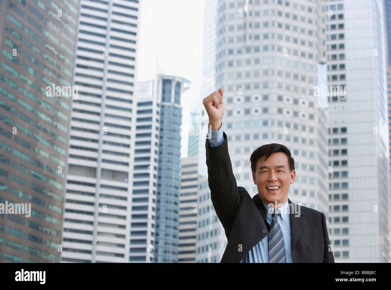 Man raising his fist Stock Photo - Alamy