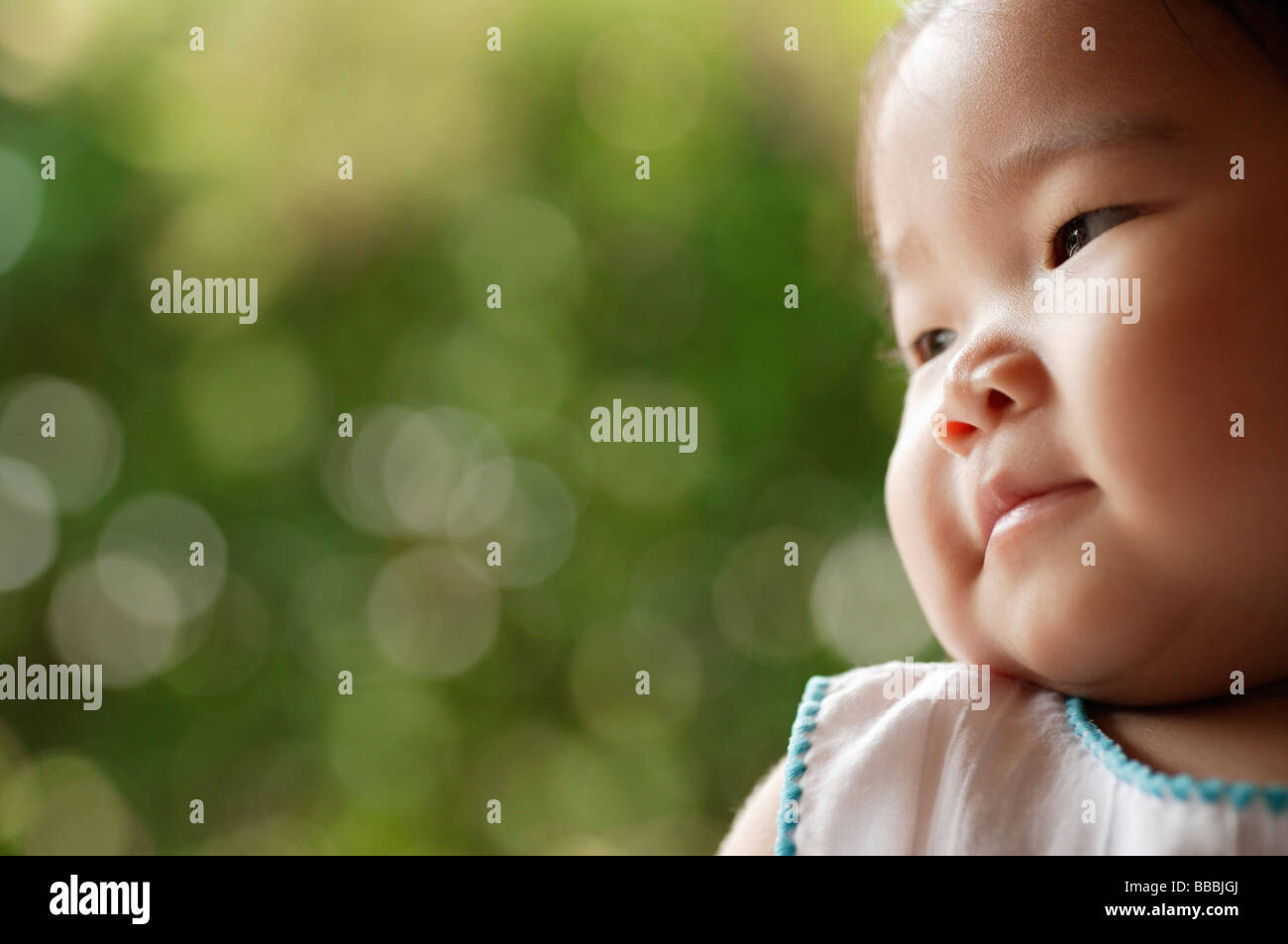 Portrait of baby girl, looking away Stock Photo - Alamy