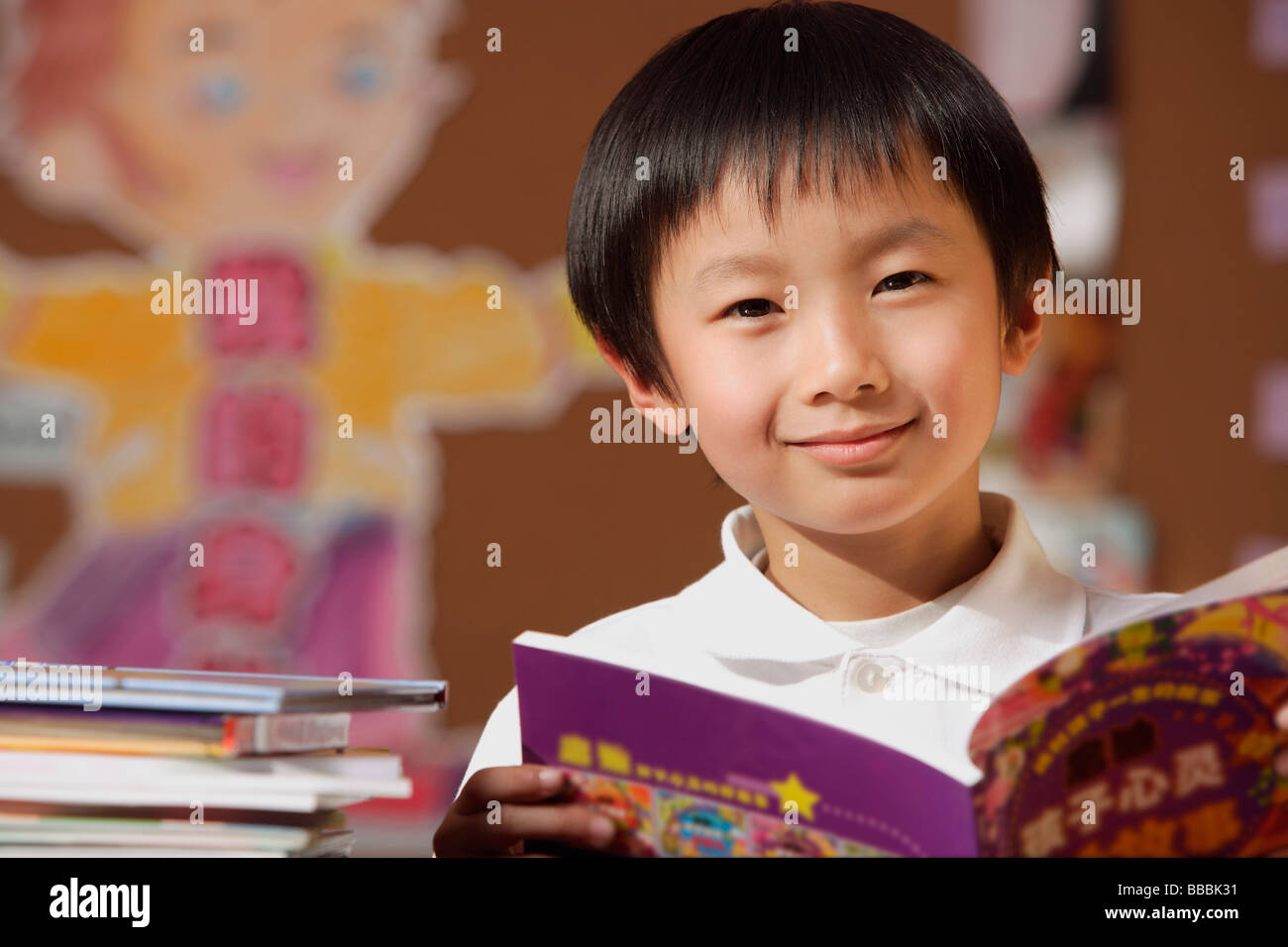 Reading Boy Inclass Schoolboy reading to class uniform hi-res stock photography and images ...