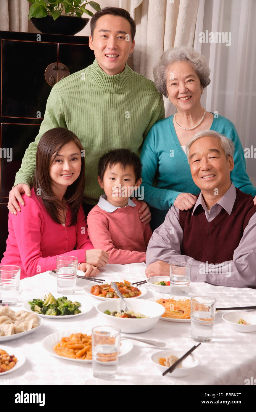 Family at dinner table with traditional food Stock Photo - Alamy