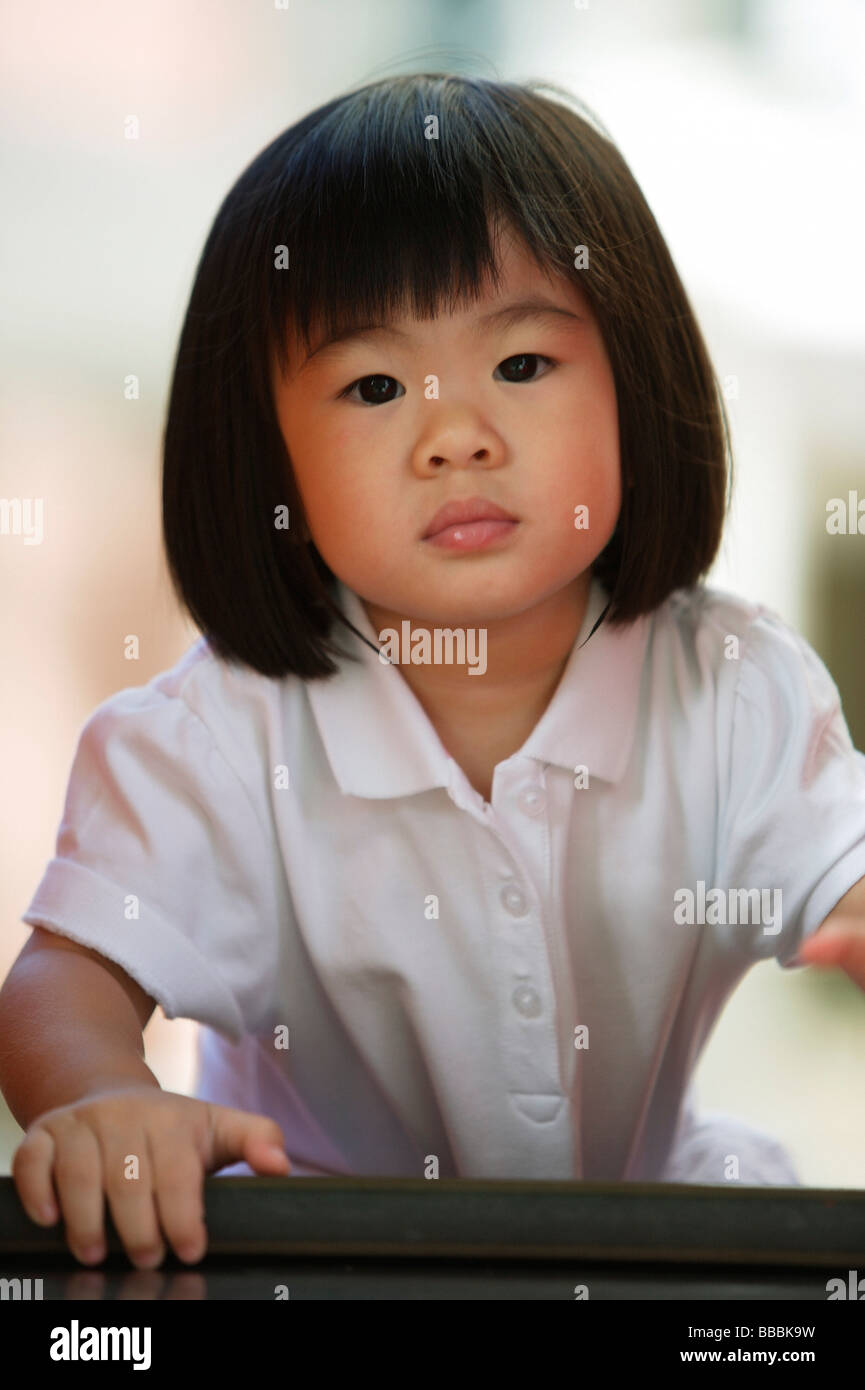 Young girl looking at camera Stock Photo - Alamy