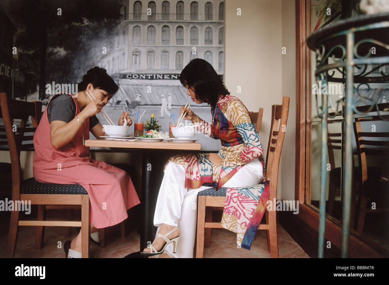 Vietnam, Ho Chi Minh City, Patrons eating at the Givral Restaurant (featured in film: The Quiet American). Stock Photo
