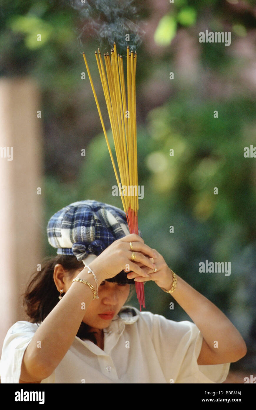 Young woman holding incense sticks hi-res stock photography and images ...