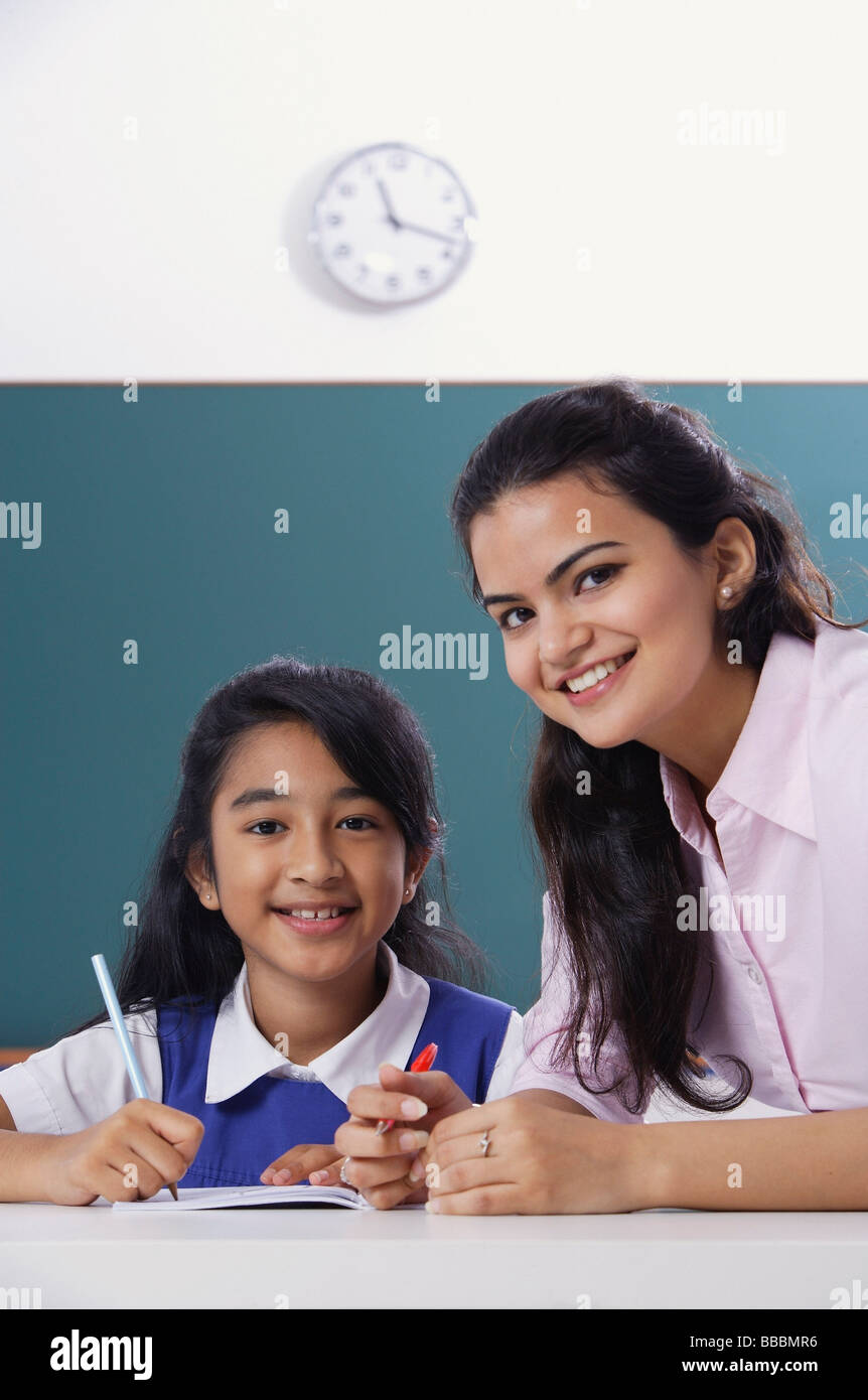 teacher and student smile at camera (close up Stock Photo - Alamy