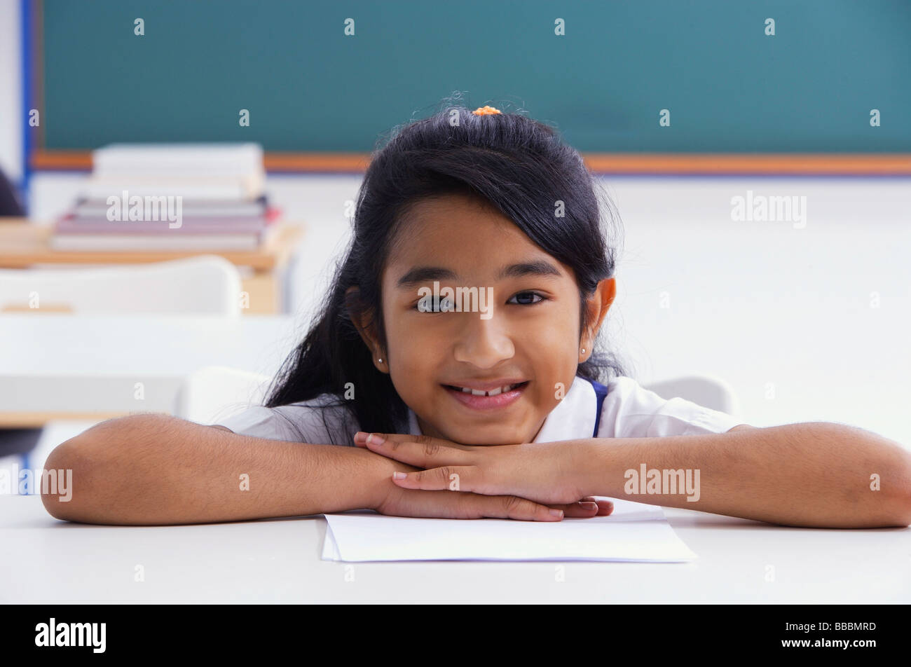 female student resting chin on hands (horizontal Stock Photo Alamy