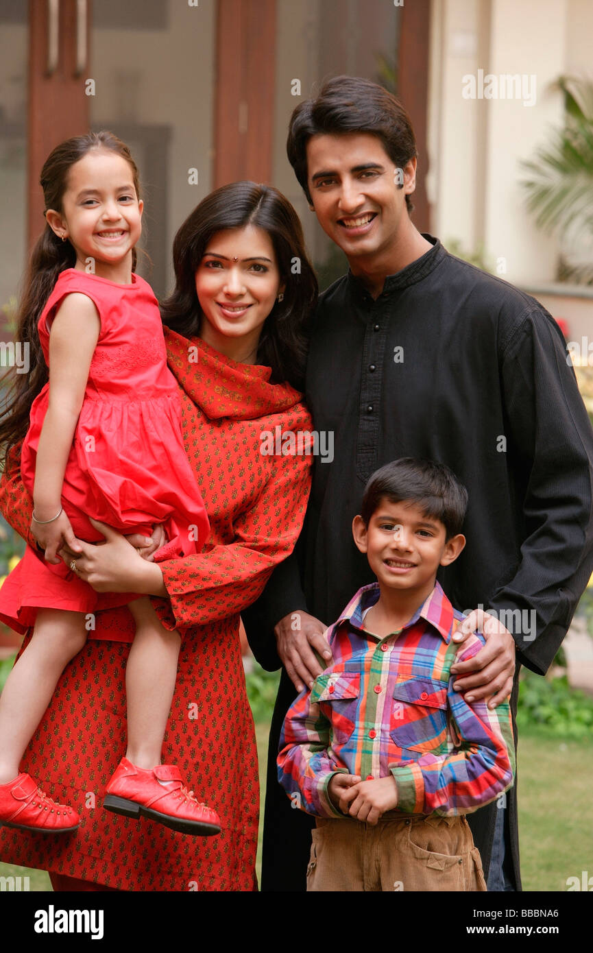 family of four outdoor portrait, smiling at camera Stock Photo