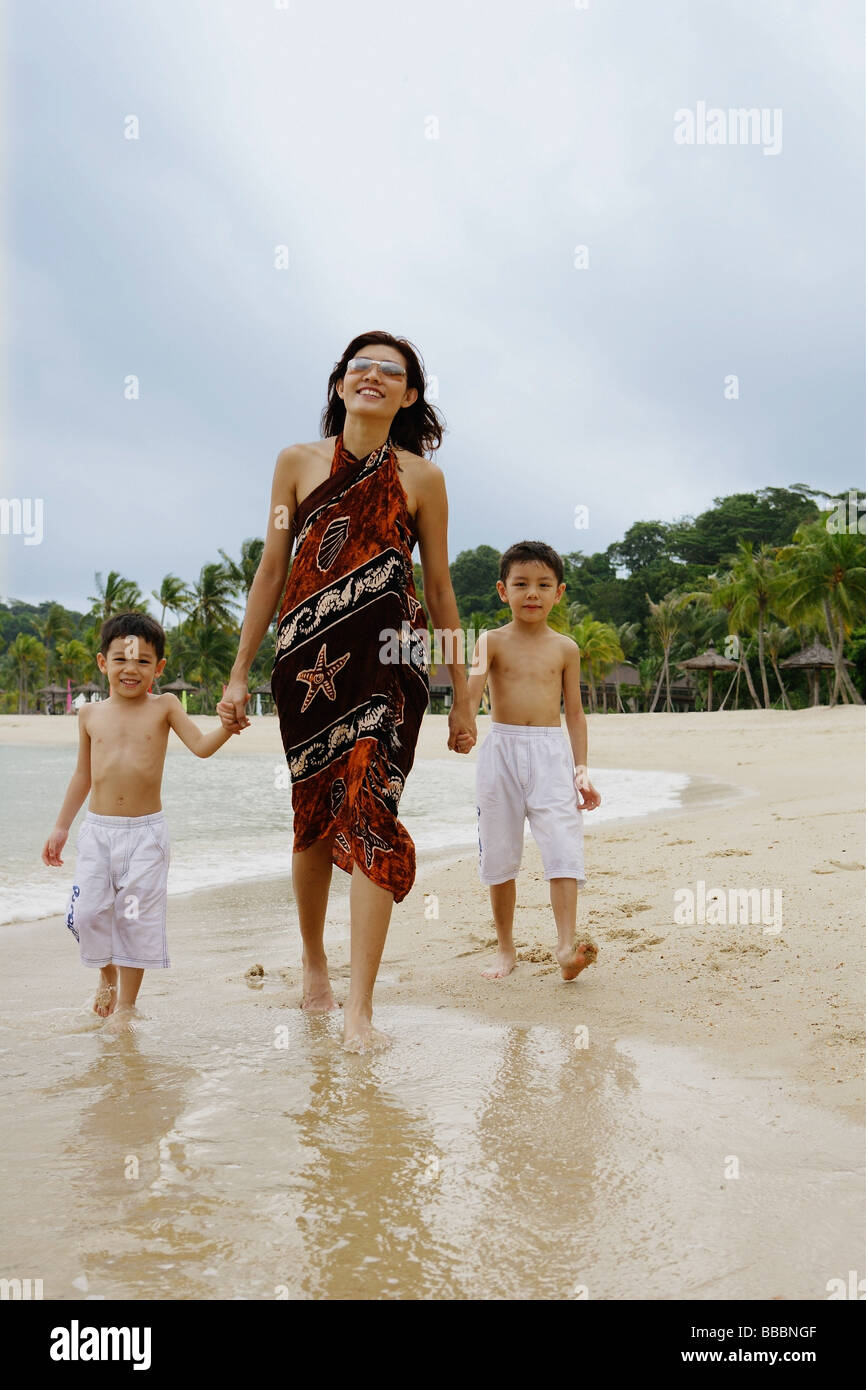 Mother With Two Boys, Walking On Beach, Portrait Stock Photo - Alamy