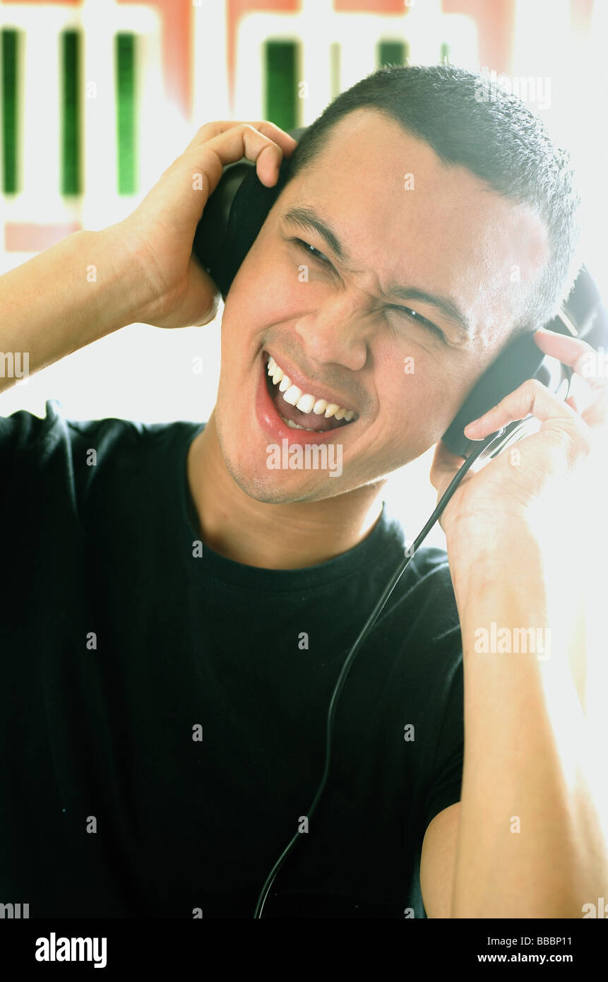 Portrait happy man headphones hi-res stock photography and images - Alamy
