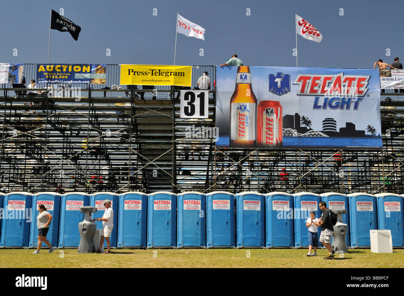 Striking lineup of portable toilets serving the public during the yearly Toyota Grand Prix held in Long Beach, California Stock Photo