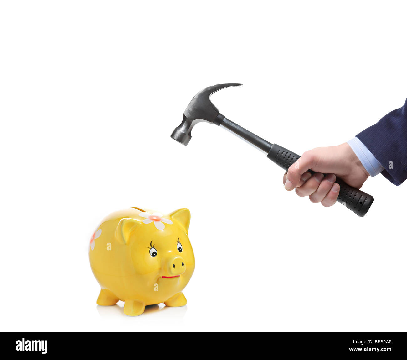 Man crashing a piggy bank with a hammer Stock Photo - Alamy