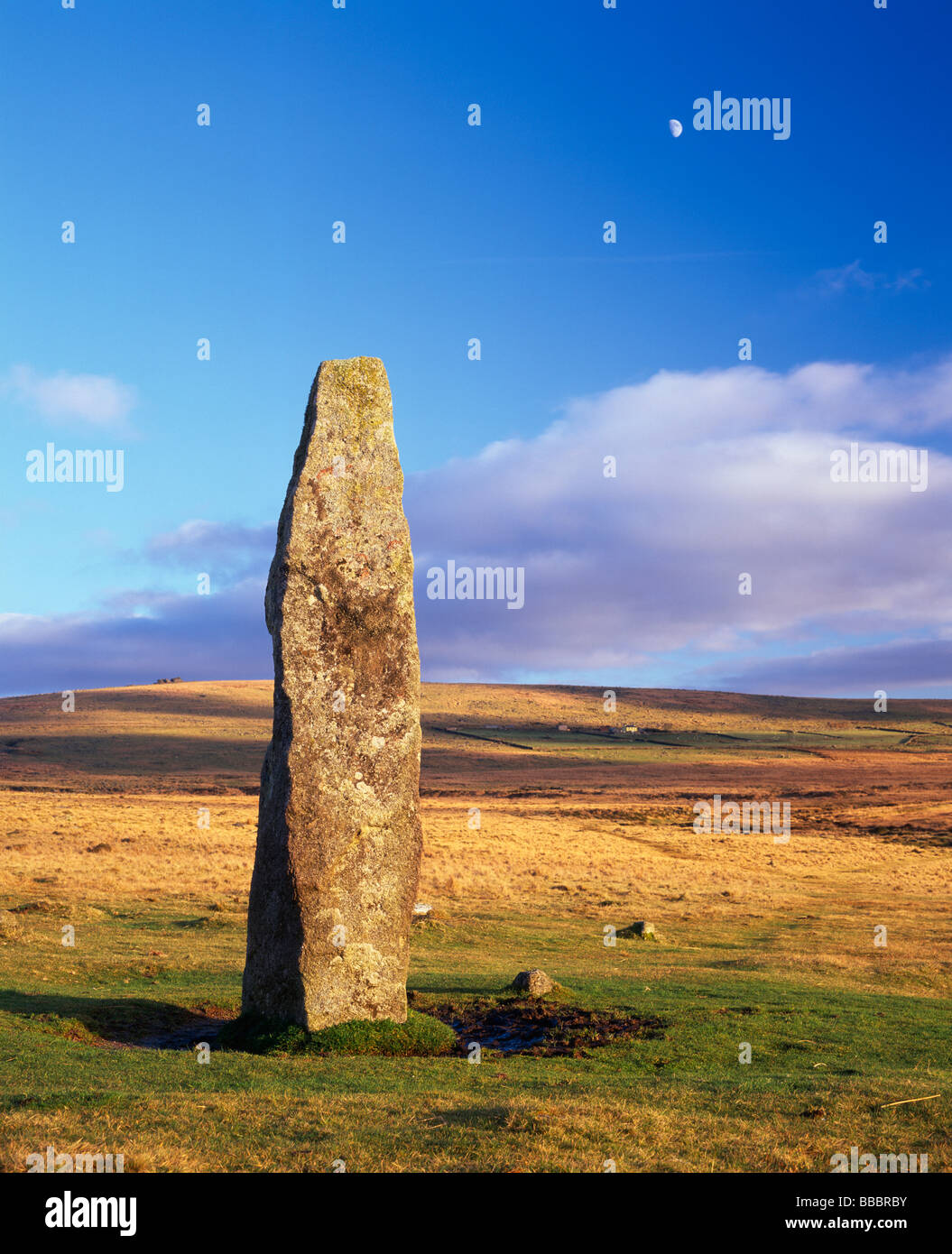 Menhir (Standing Stone) at Merrivale, Dartmoor, Devon, UK, with moon in background Stock Photo