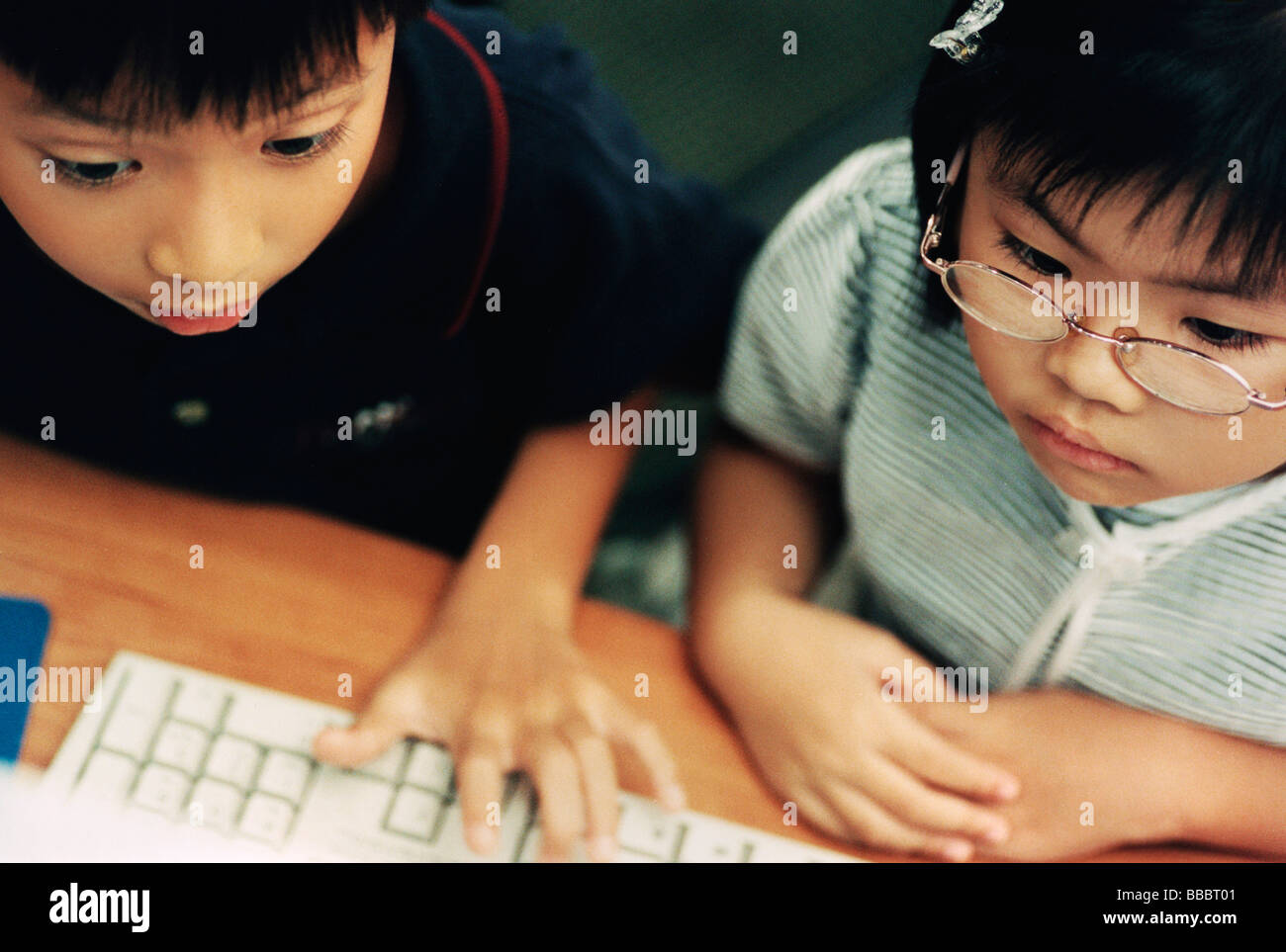 Children using computer, elevated view ( high grain Stock Photo - Alamy