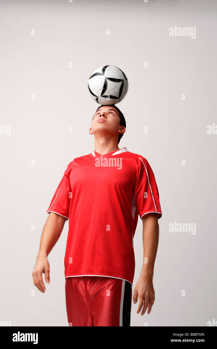 Soccer player with ball on head Stock Photo Alamy
