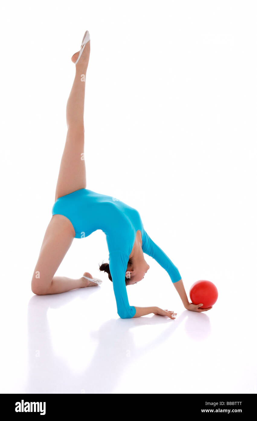 Rhythmic gymnastics, woman doing routine with ball Stock Photo - Alamy