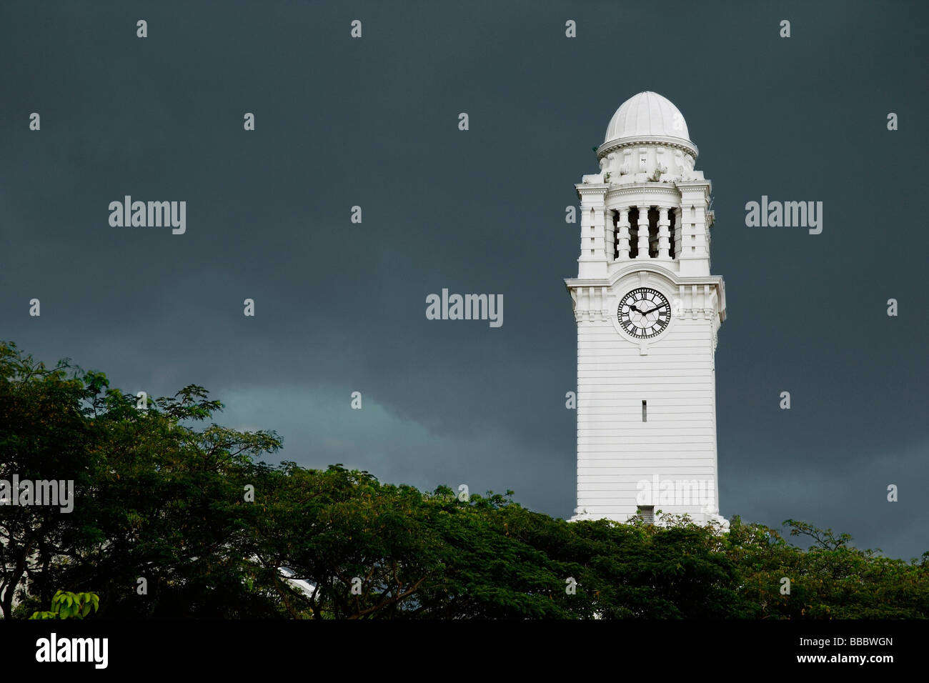 Clock tower against dark skies Stock Photo
