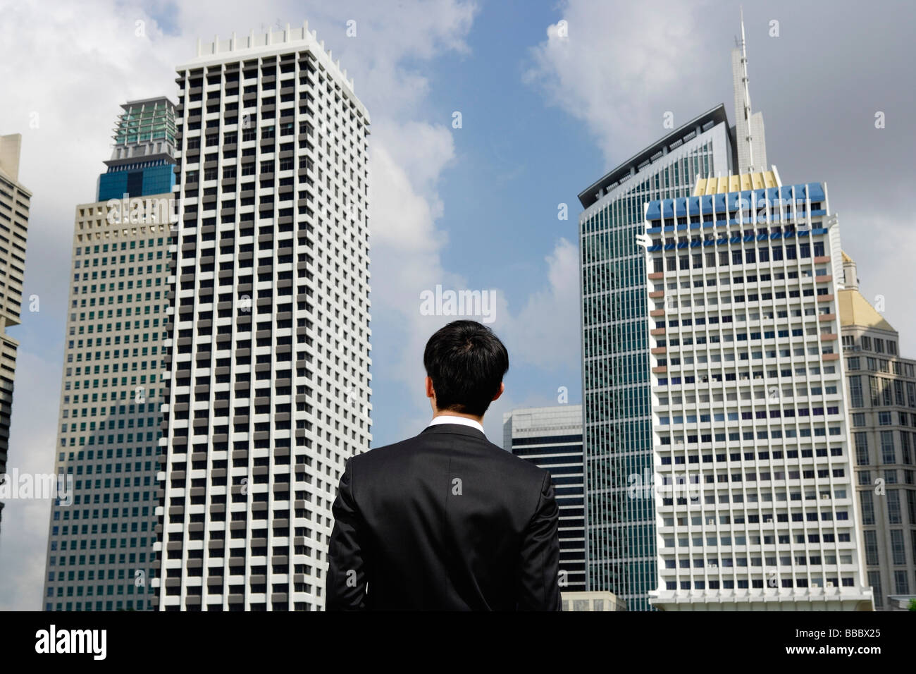 Businessman surrounded by buildings hi-res stock photography and images ...