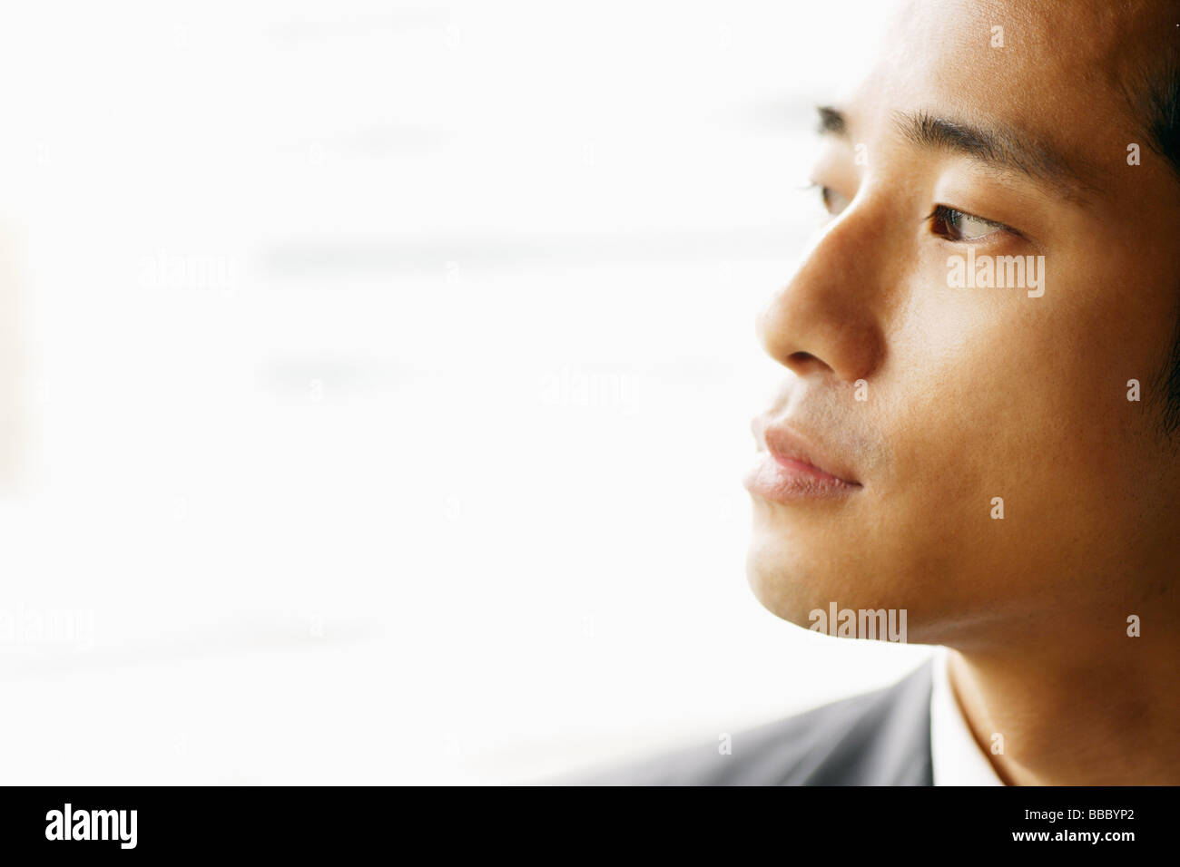 Man looking away, sideview Stock Photo