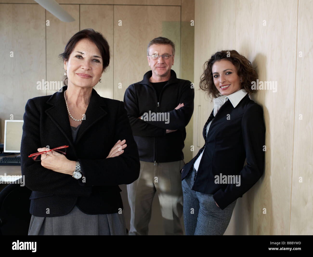 Portrait of business woman with colleges Stock Photo