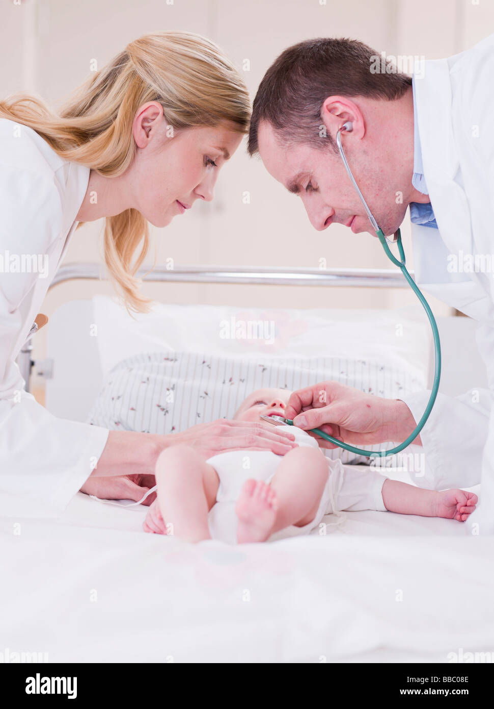 two medics tending to a child Stock Photo