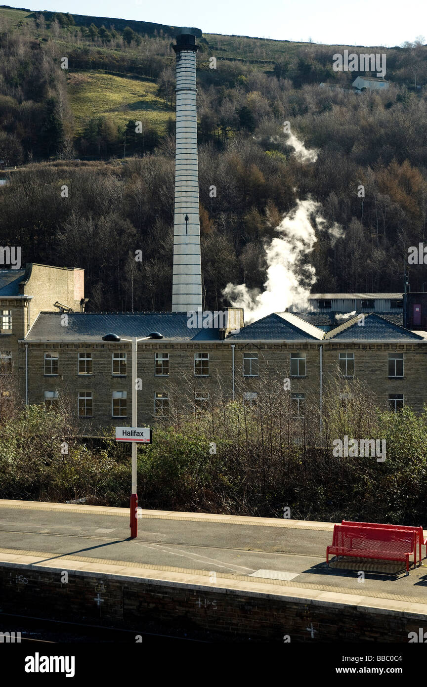 Halifax railway station platform with chocolate factory chimney in background Stock Photo