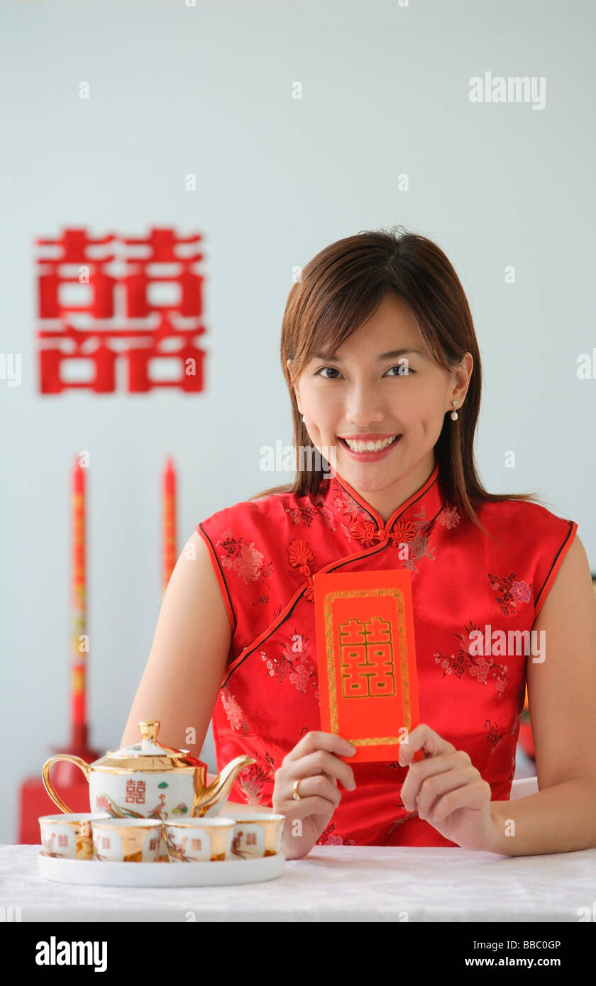 Young woman in traditional clothing, smiling at camera Stock Photo - Alamy