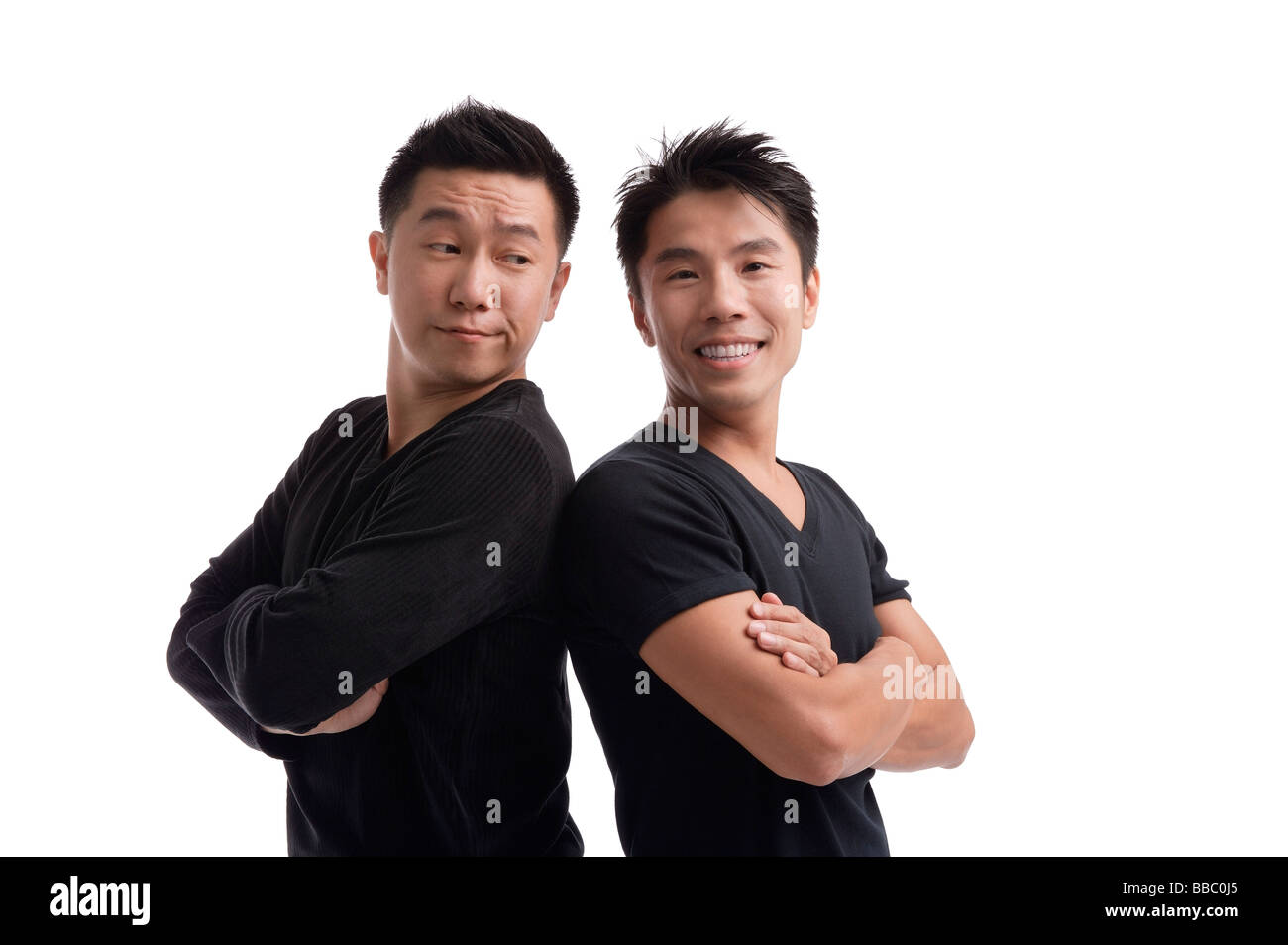 Men standing shoulder to shoulder Stock Photo - Alamy