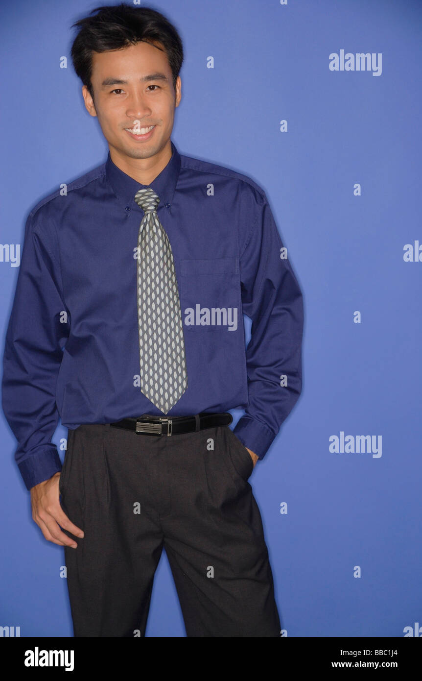 Young man smiling at camera Stock Photo - Alamy
