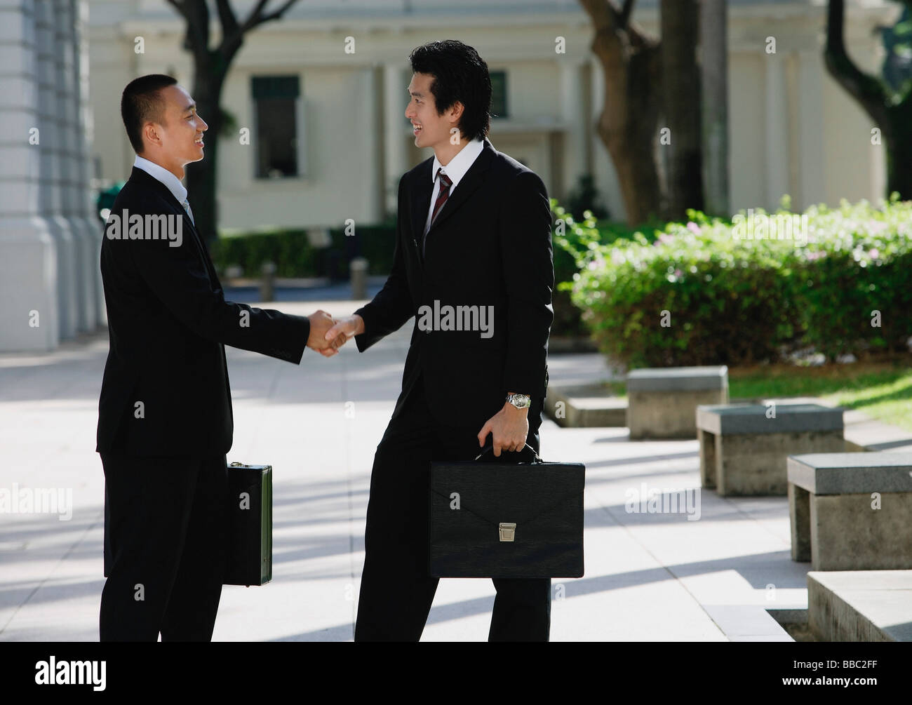 Men wearing black suits hi-res stock photography and images - Alamy