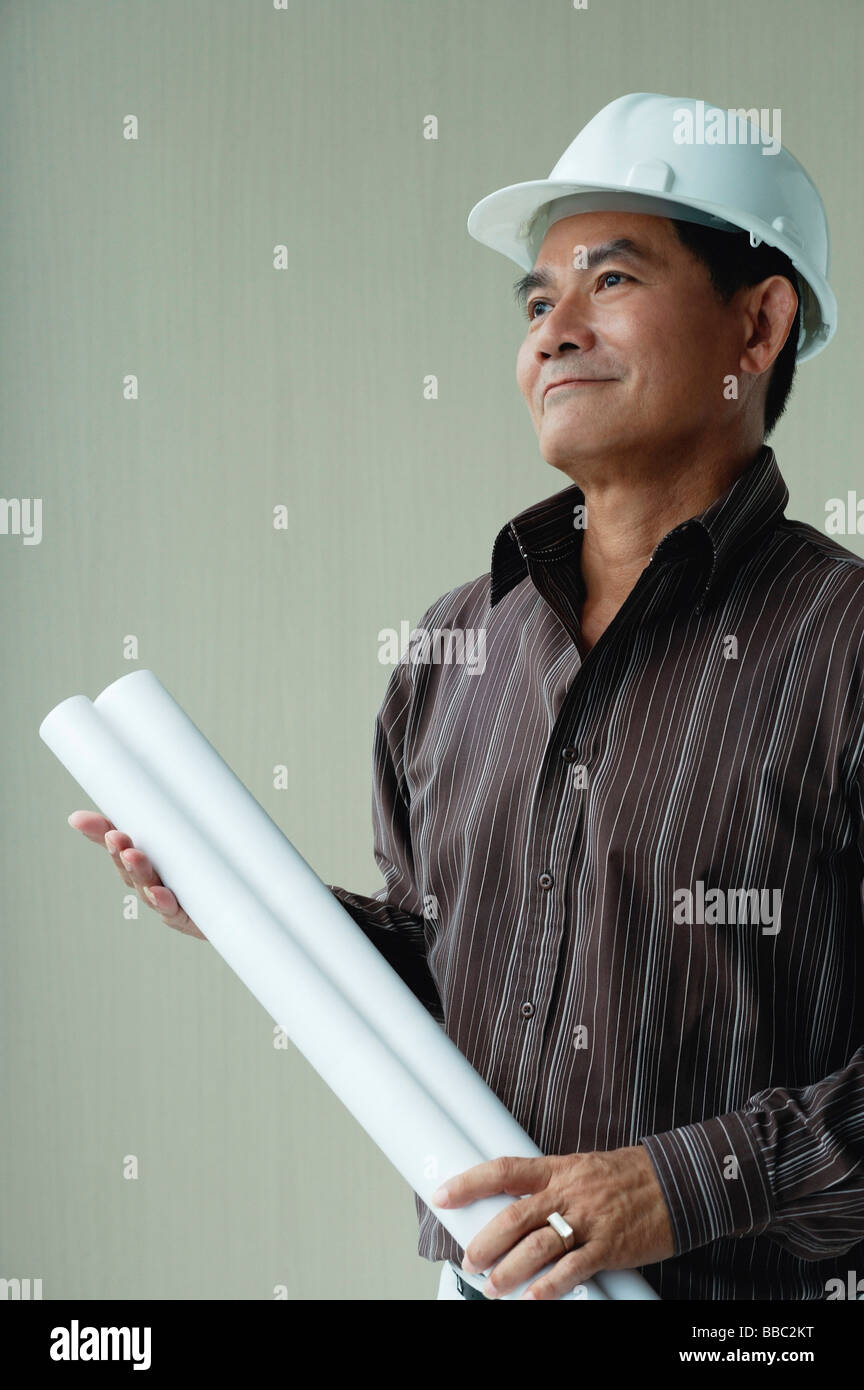 Rolled up blueprints helmet hi-res stock photography and images - Alamy