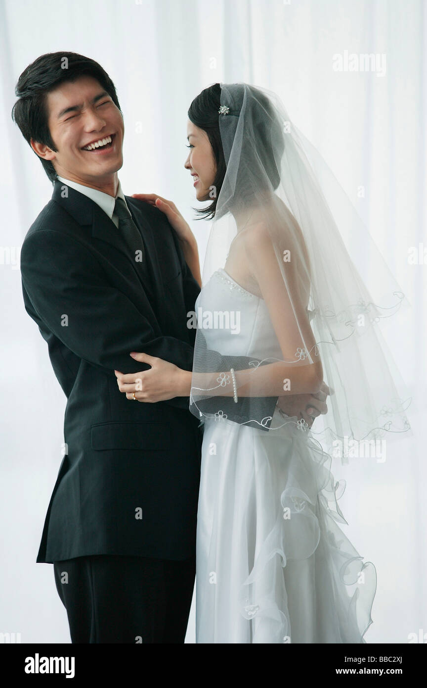 Woman arms around man wedding hi-res stock photography and images - Alamy