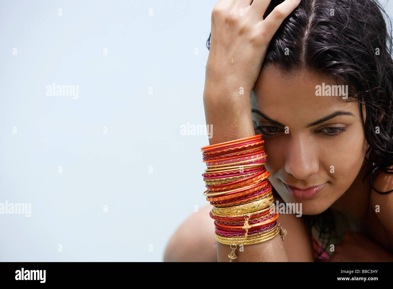 Hand wearing bracelets hi-res stock photography and images - Alamy