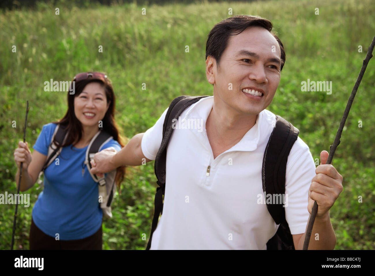 Mature woman hiking with men hi-res stock photography and images - Alamy