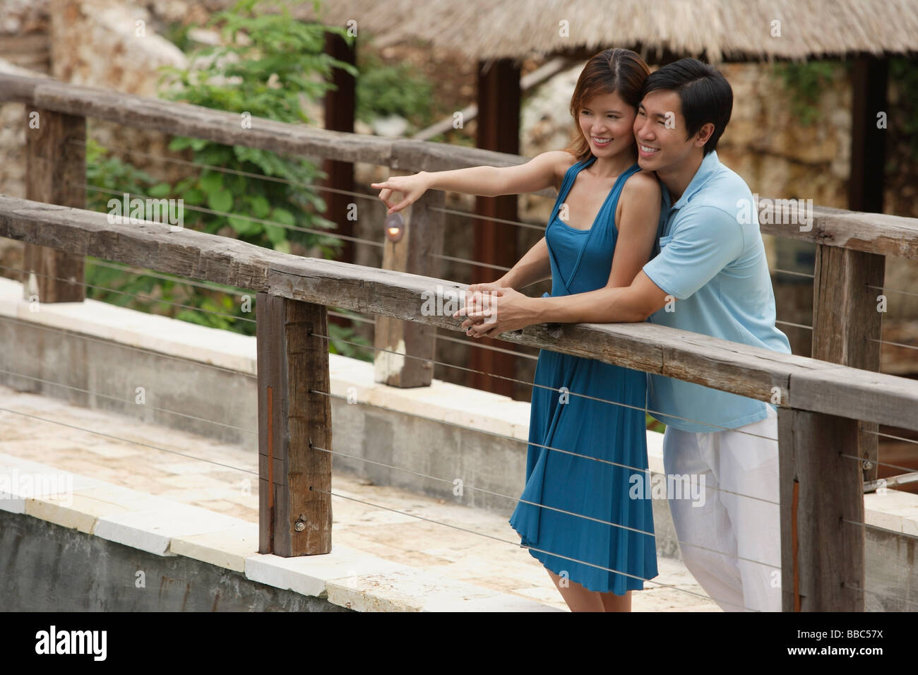 Couple standing side by side on bridge hi-res stock photography and ...