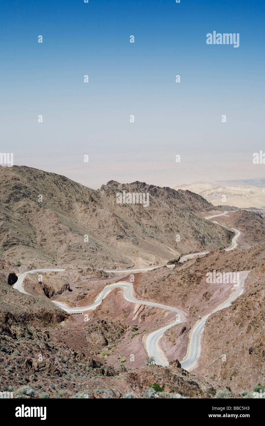 A curvy mountain road in desert in Jordan. Stock Photo
