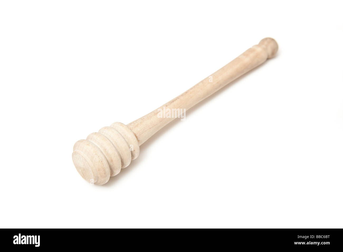 honey spoon isolated on a white studio background Stock Photo - Alamy