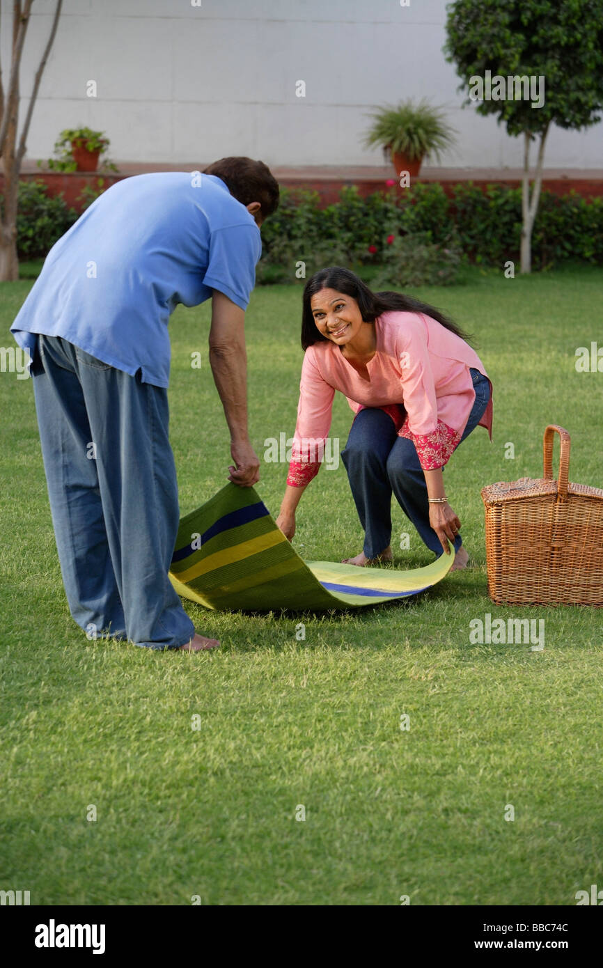 couple setting up picnic Stock Photo