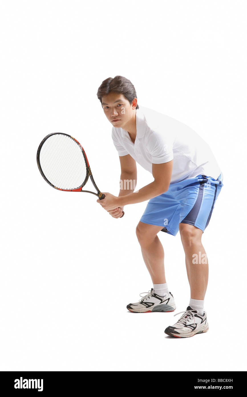 Young man holding tennis racket Stock Photo Alamy